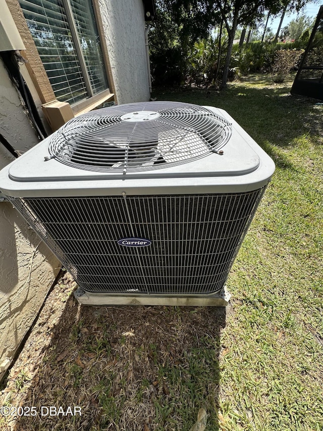 details with stucco siding and central AC unit
