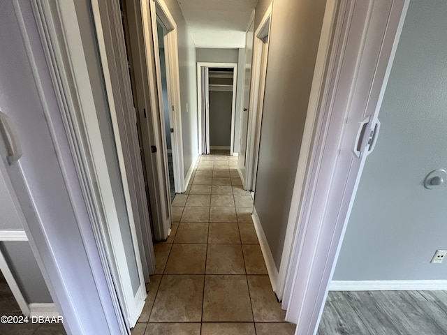 506 Cambridge Cir S, Daytona, FL 32119 - hallway with tile patterned floors and baseboards
