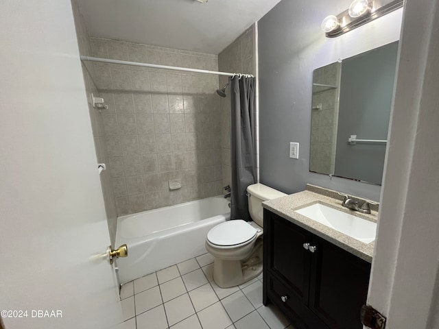 full bathroom featuring toilet, vanity, tile patterned floors, and shower / tub combo