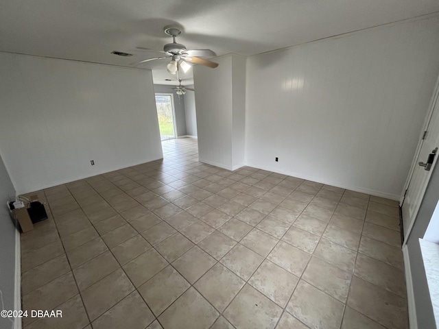 506 Cambridge Cir S, Daytona, FL 32119 - unfurnished room featuring ceiling fan and light tile patterned floors