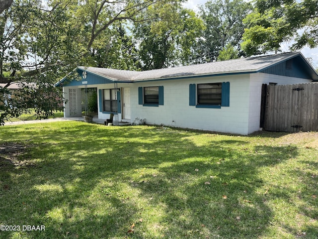 506 Cambridge Cir S, Daytona, FL 32119 - ranch-style house with concrete block siding and a shingled roof