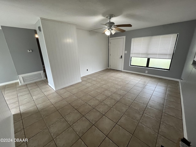 506 Cambridge Cir S, Daytona, FL 32119 - unfurnished room with a ceiling fan and tile patterned flooring