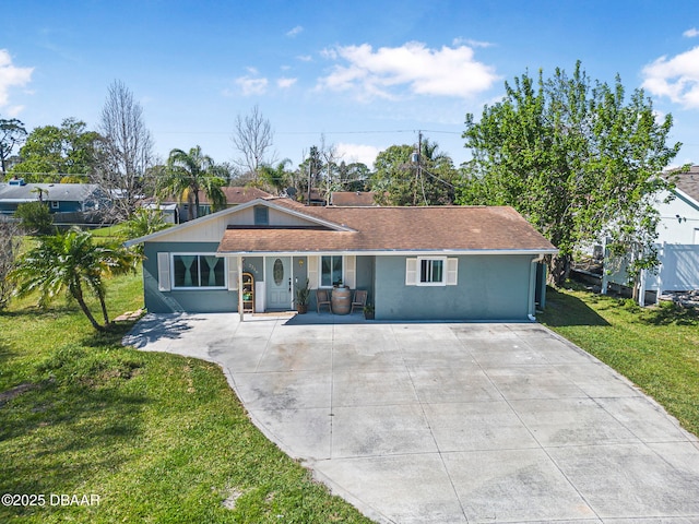 single story home featuring roof with shingles, a front yard, and stucco siding