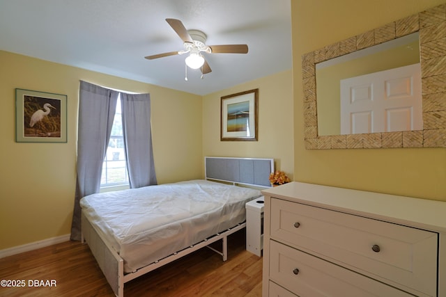 bedroom featuring ceiling fan and light wood-type flooring