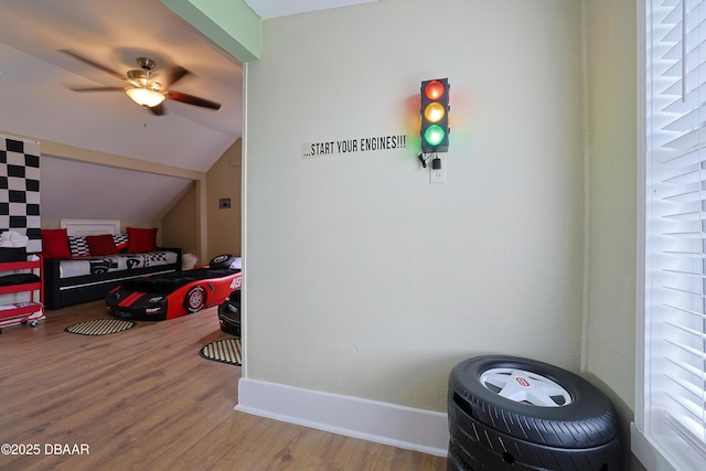 interior space with hardwood / wood-style floors and vaulted ceiling