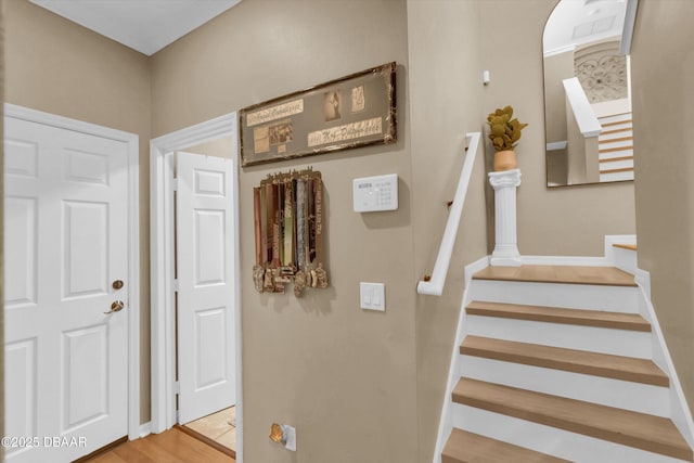1767 Travertine Ter, Sanford, FL 32771 - stairs featuring wood finished floors and baseboards