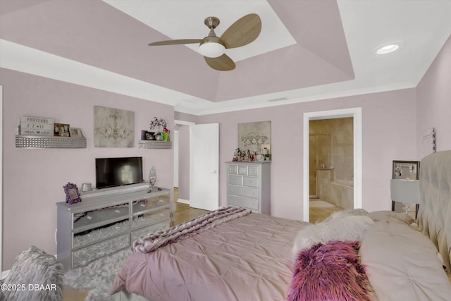 1767 Travertine Ter, Sanford, FL 32771 - bedroom with a raised ceiling, visible vents, connected bathroom, and a ceiling fan