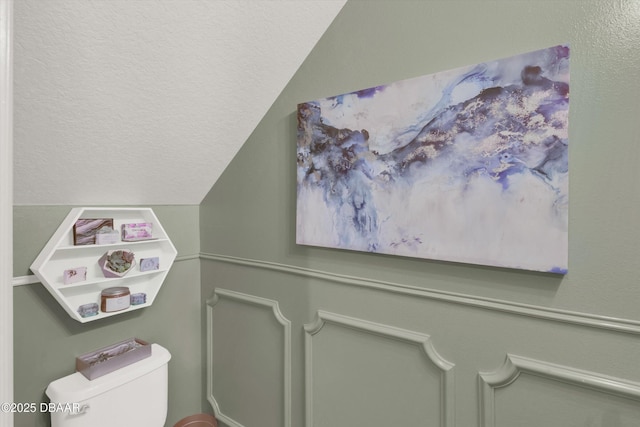 1767 Travertine Ter, Sanford, FL 32771 - half bathroom featuring a textured ceiling, toilet, and vaulted ceiling