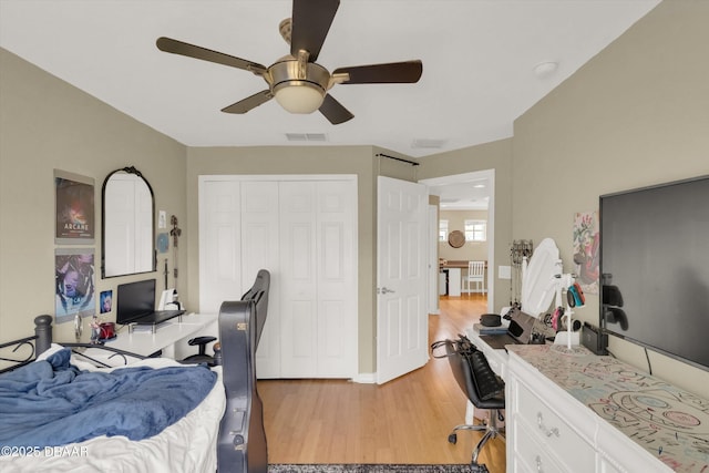 1767 Travertine Ter, Sanford, FL 32771 - bedroom with light wood-style floors, a closet, ceiling fan, baseboards, and visible vents