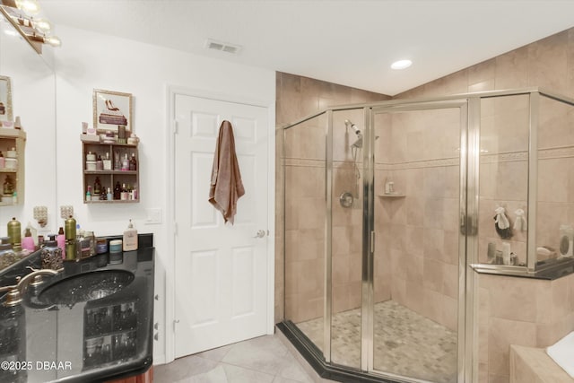 1767 Travertine Ter, Sanford, FL 32771 - bathroom featuring tile patterned floors, visible vents, a stall shower, and a sink