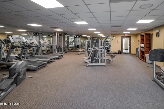 workout area featuring a paneled ceiling