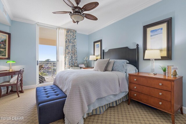 carpeted home office with a raised ceiling and crown molding