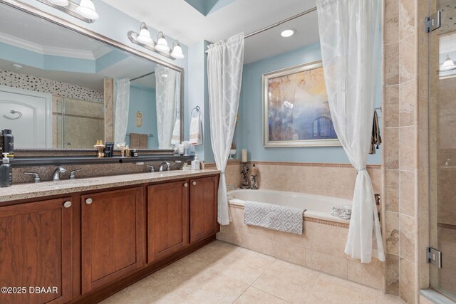 kitchen featuring light stone counters, stainless steel dishwasher, crown molding, sink, and light tile patterned floors