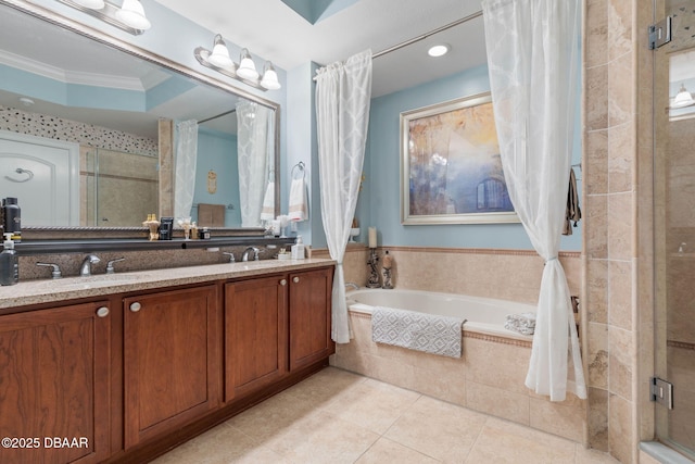 full bath with double vanity, tile patterned floors, crown molding, a shower stall, and a bath