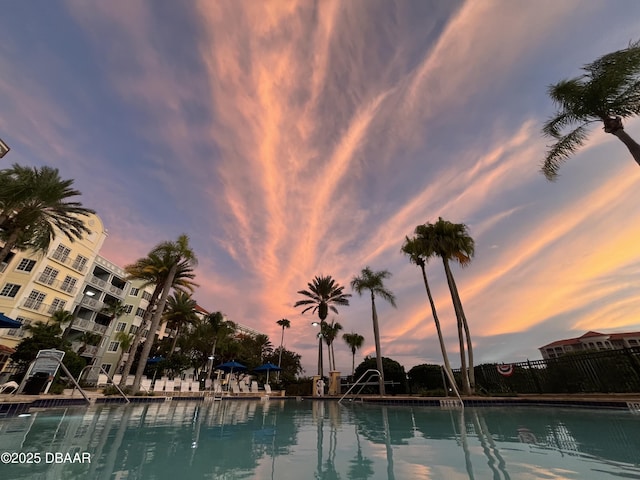 view of pool at dusk