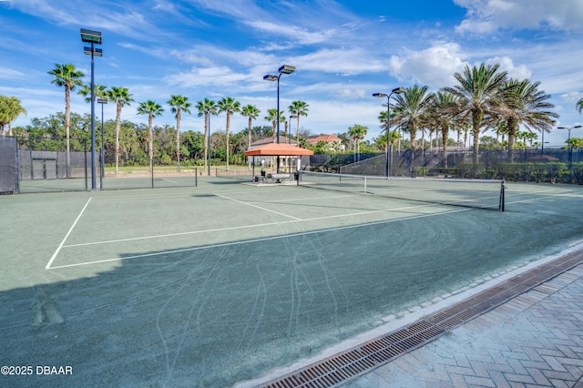 view of sport court with fence