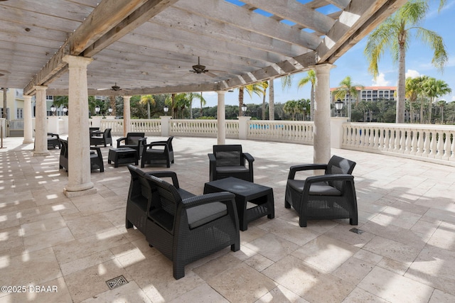 view of patio with ceiling fan, fence, an outdoor hangout area, and a pergola