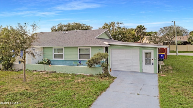 single story home with a front lawn and a garage