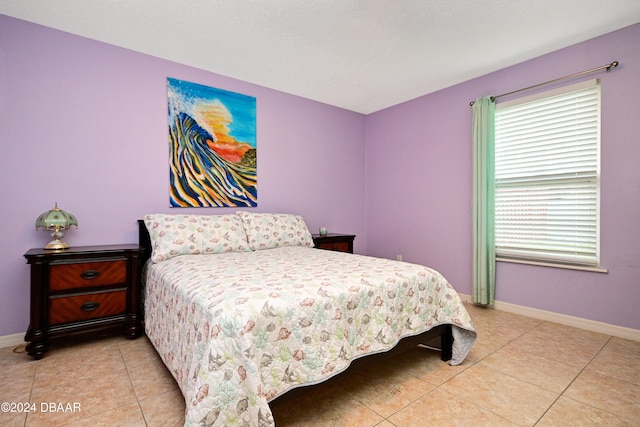 bedroom featuring light tile patterned flooring