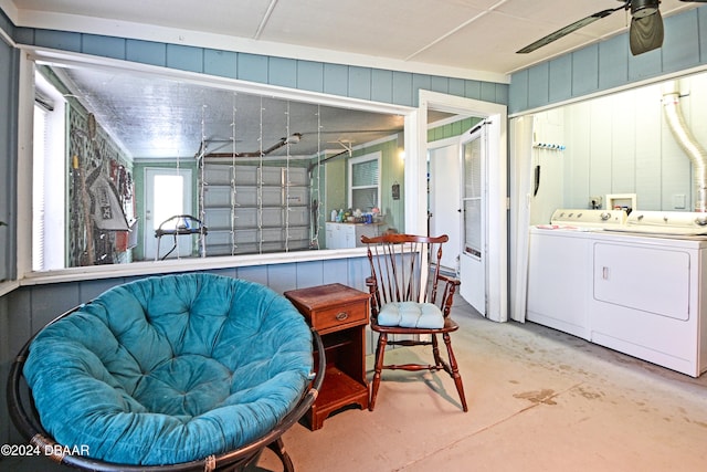 interior space featuring concrete flooring, ceiling fan, and washer and clothes dryer