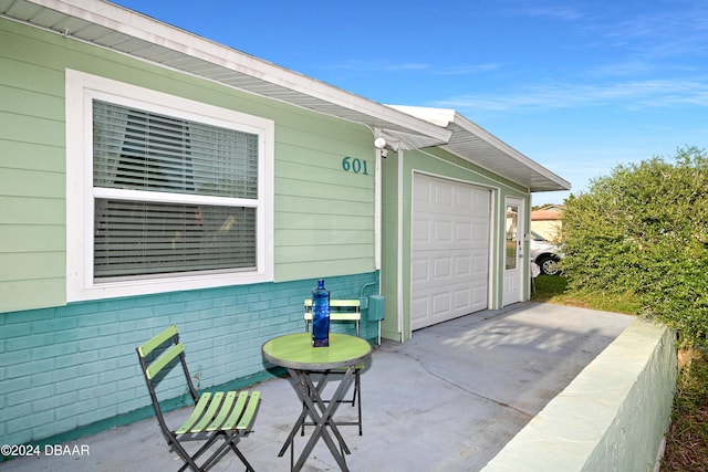 view of patio with a garage