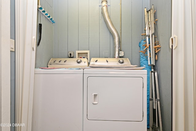 laundry area with independent washer and dryer