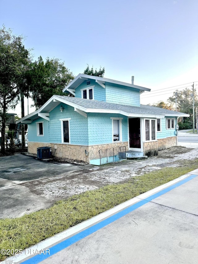 view of front of home with cooling unit