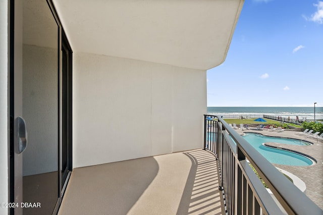 balcony featuring a water view