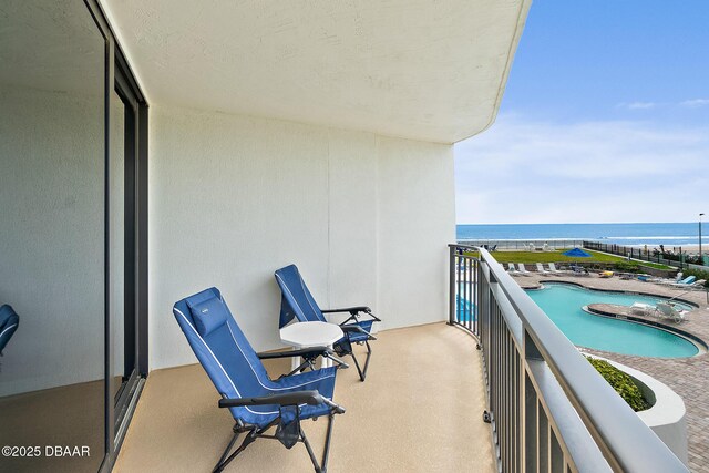 balcony featuring a water view