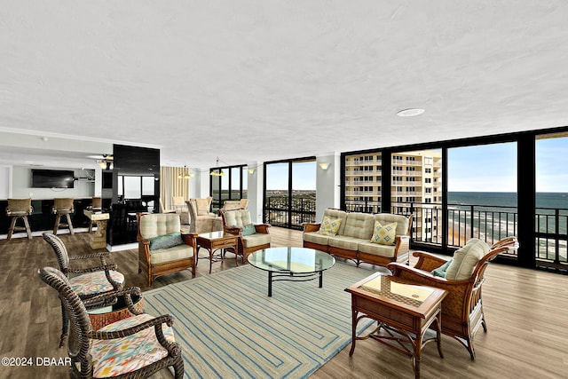 2555 S Atlantic Ave Unit 207, Daytona Beach Shores, FL 32118 - living room with floor to ceiling windows and wood finished floors