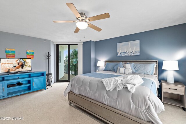 carpeted bedroom featuring floor to ceiling windows, access to outside, and a ceiling fan
