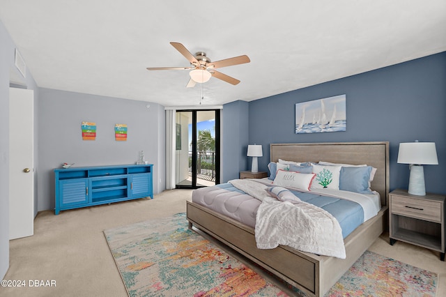 carpeted bedroom featuring access to outside and ceiling fan