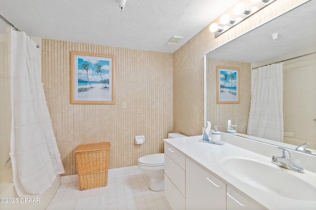 bathroom featuring tile patterned floors, wallpapered walls, toilet, vanity, and a shower with curtain