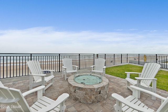 view of patio with an outdoor fire pit and a fenced backyard
