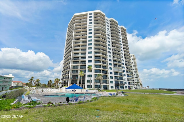 view of apartment building / complex featuring a community pool