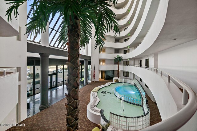 view of pool featuring ornate columns