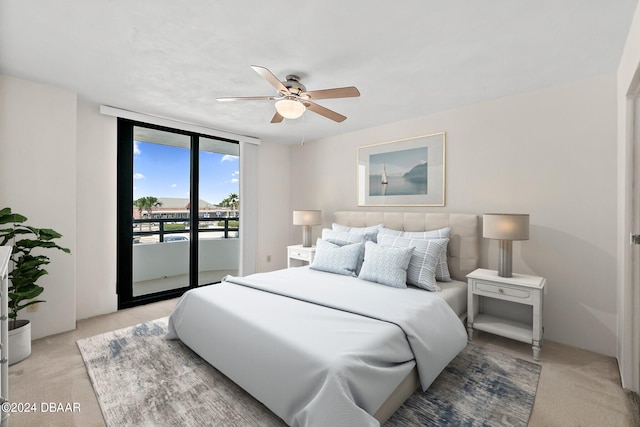 bedroom with access to outside, floor to ceiling windows, light colored carpet, and ceiling fan