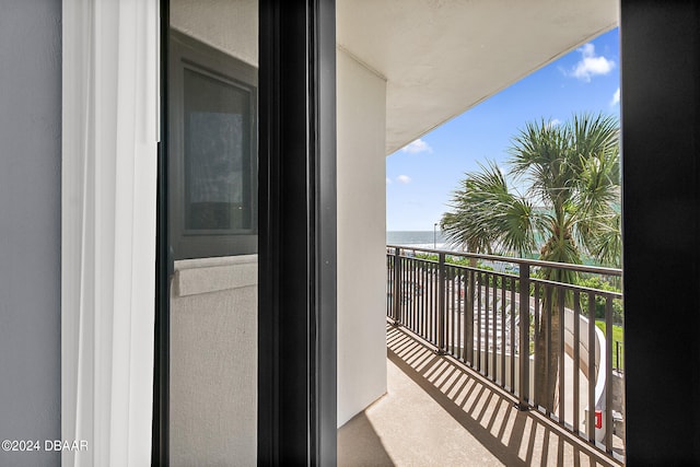 balcony featuring a water view