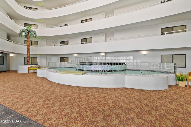 view of community featuring a high ceiling