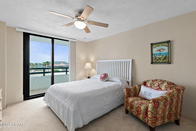 carpeted bedroom featuring access to exterior and ceiling fan