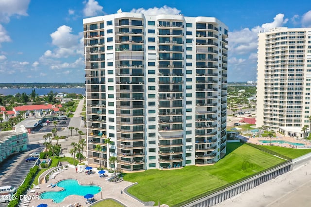 view of building exterior with a community pool