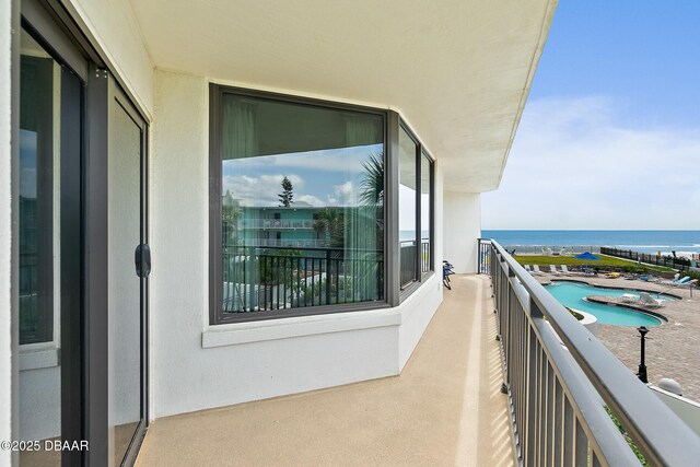 balcony featuring a water view