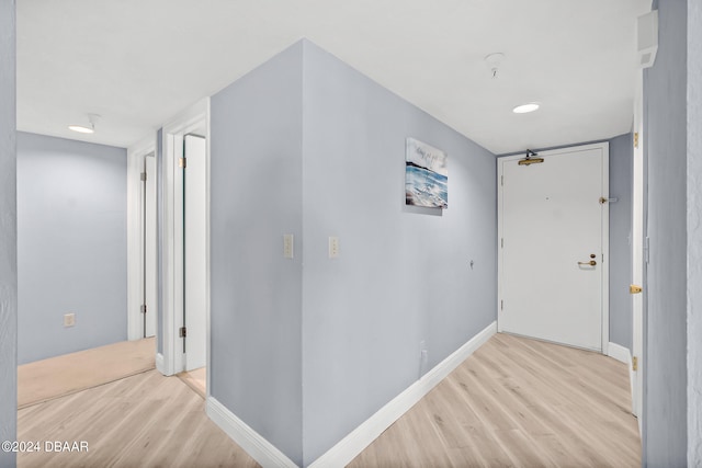 hallway with light wood-type flooring