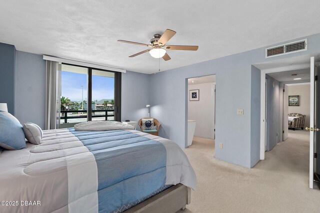 bedroom featuring light colored carpet, access to exterior, and ceiling fan