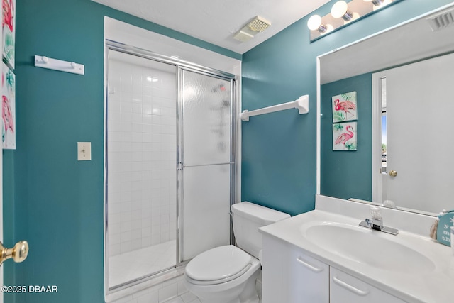 full bath with a stall shower, toilet, and vanity