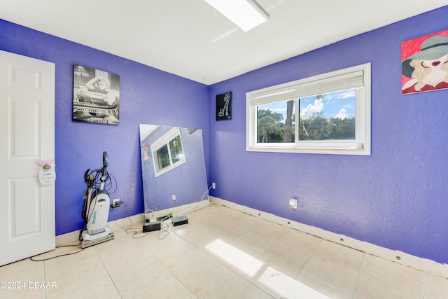 empty room with light tile patterned floors