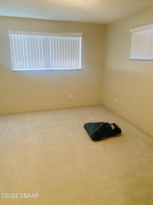 empty room featuring carpet flooring