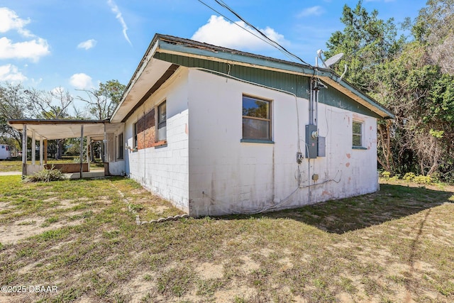 view of home's exterior with a yard