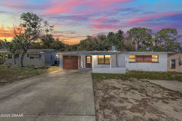 single story home with a garage