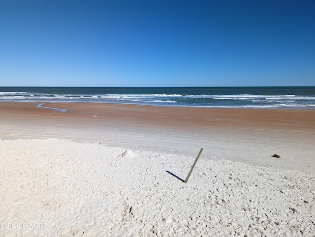 view of water feature with a beach view